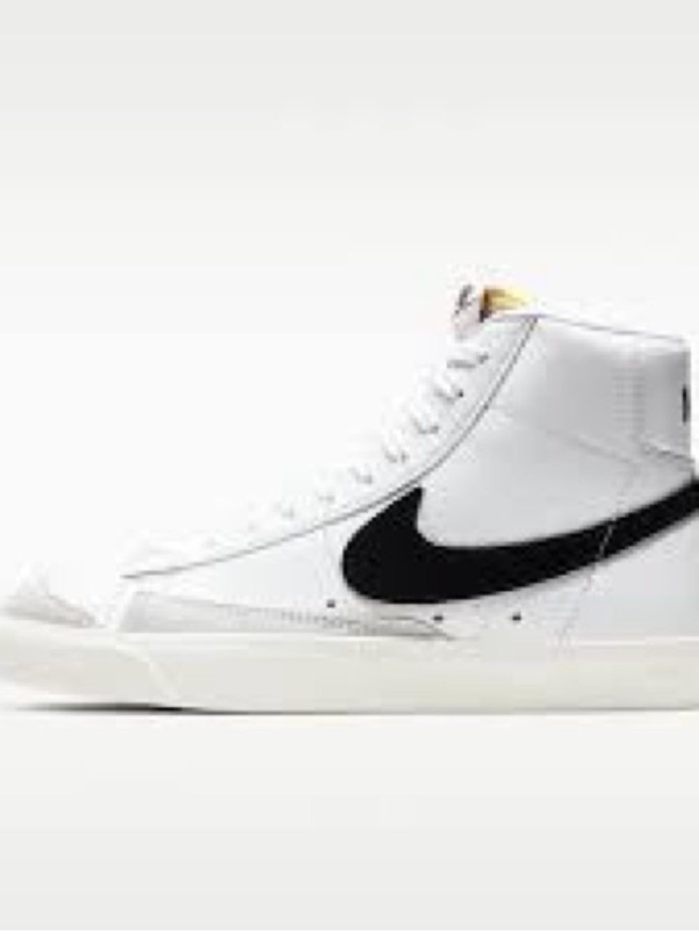 Nike White High-Top Sneakers with Black Swoosh and Yellow Tongue Detail